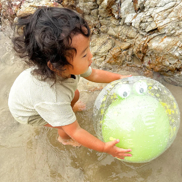 girl playing with inflatable beach ball